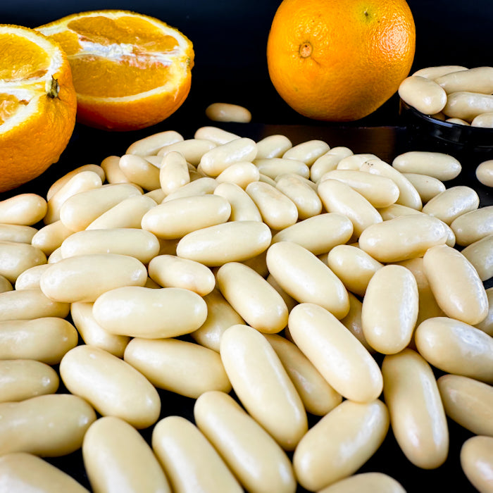 Dražejas ar apelsīnu cukātiem baltā beļģu šokolādē