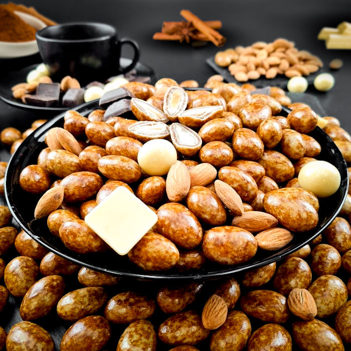 Kanēļu dražejas ar mandelēm baltā beļģu šokolādē